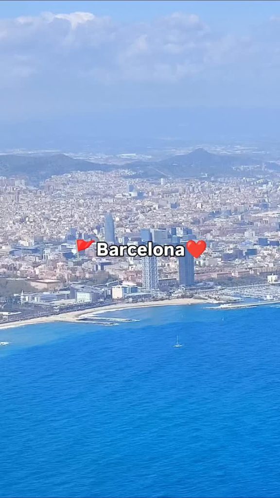 Aerial view of Barcelona's coastline and city.