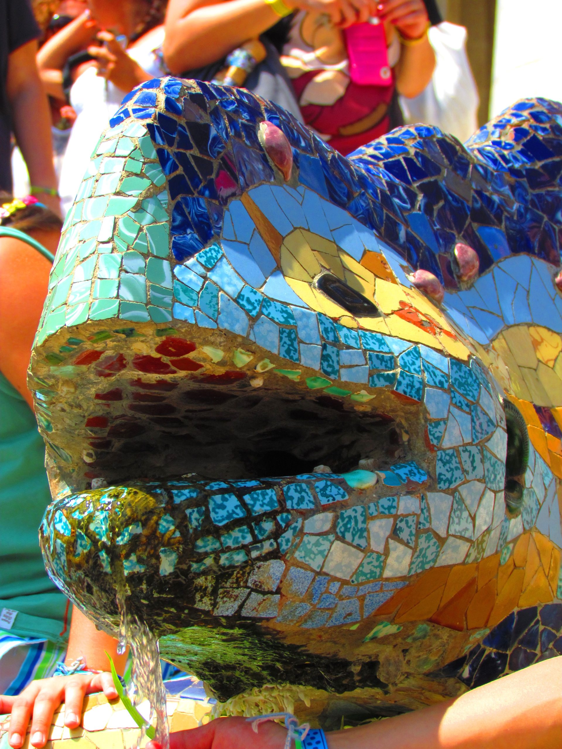 Close view of the colourful mosaic dragon fountain at Park Guell.