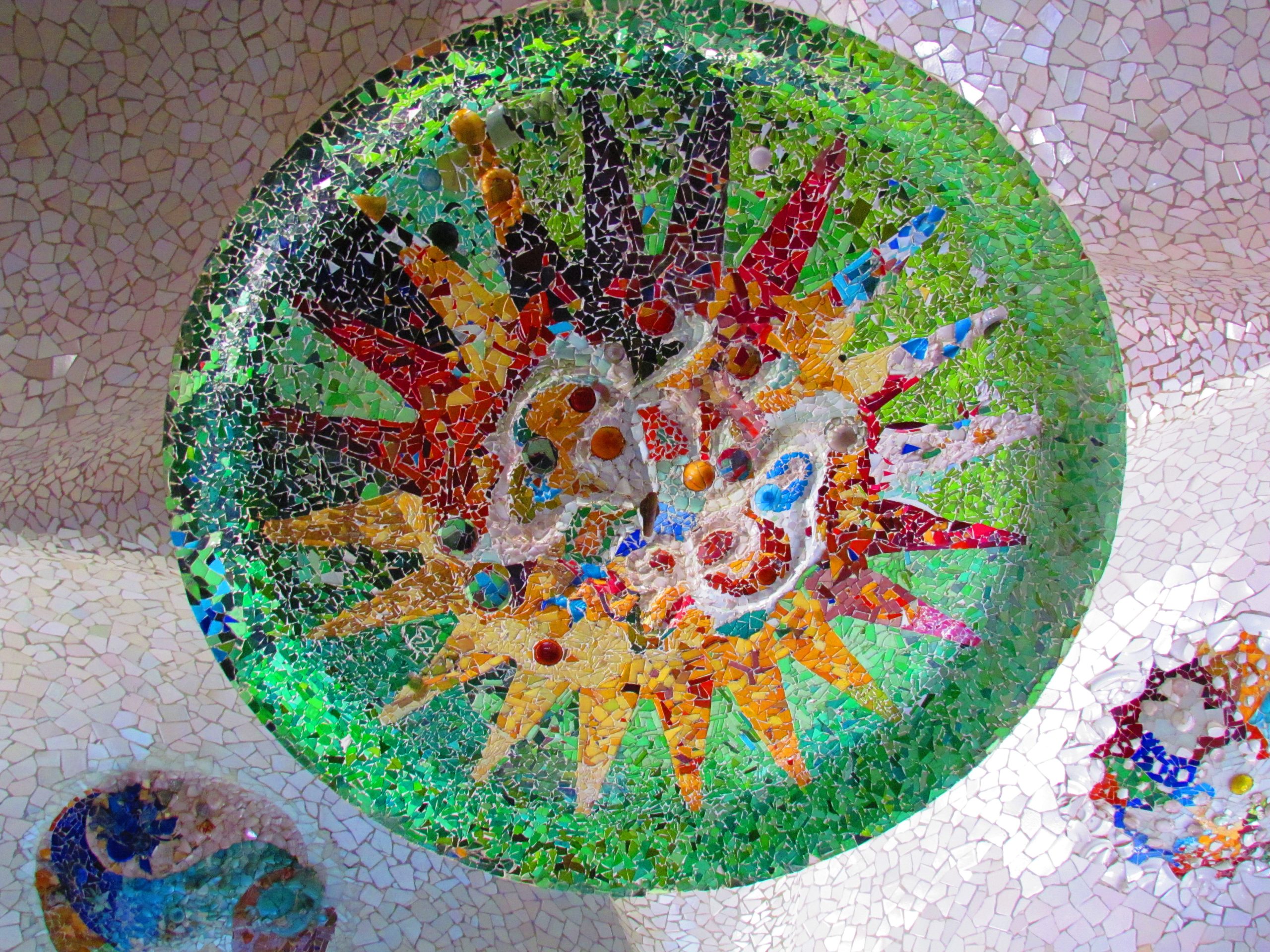 Round mosaic ceiling medallion in the Hypostyle Room at Park Guell.