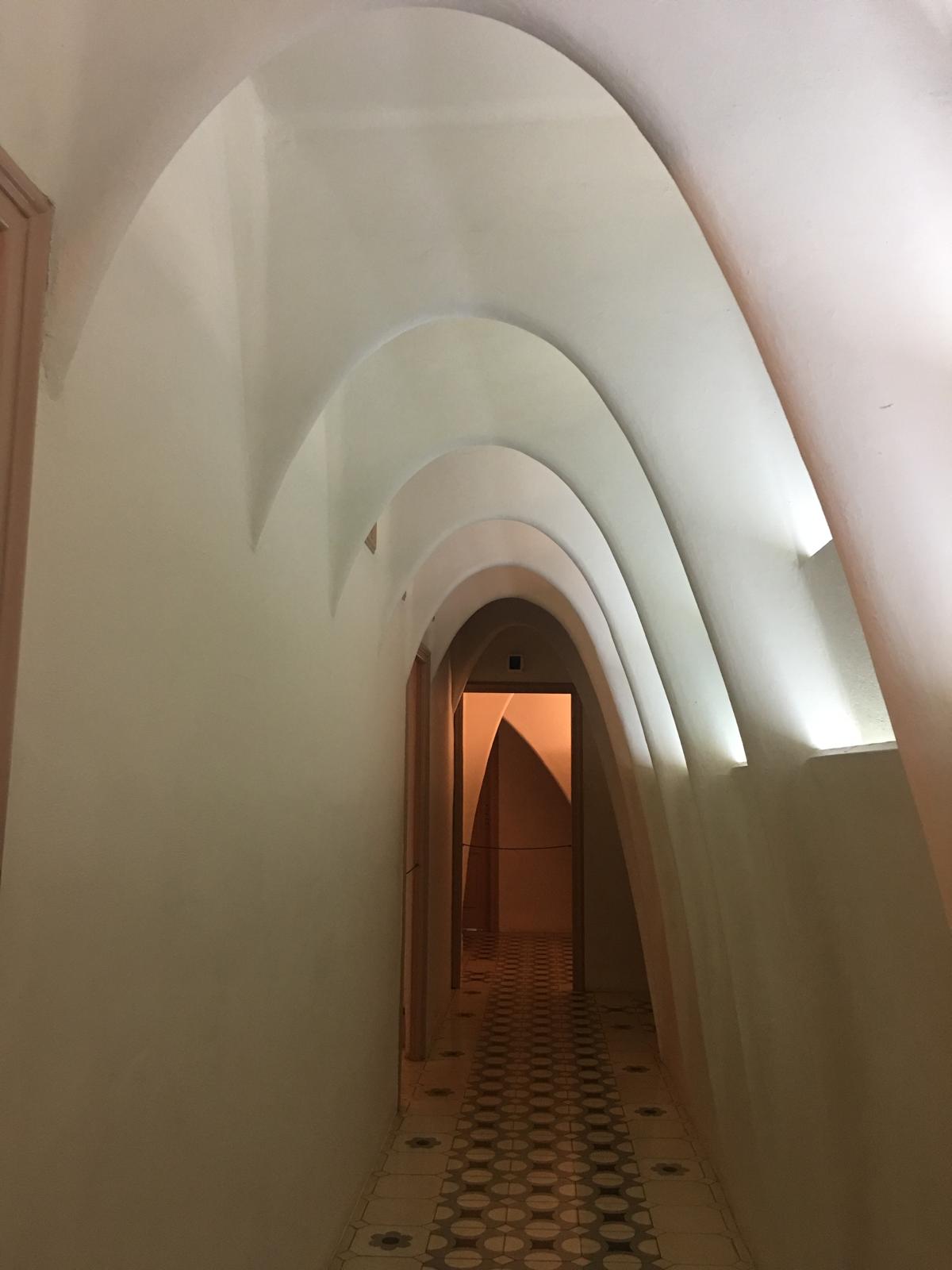 Soft white attic arches inside Casa Batllo.