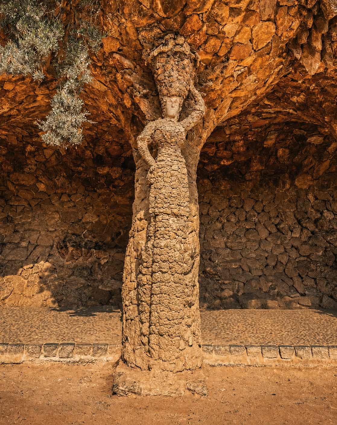 Sculpted stone figure in the Laundry Room Portico at Park Guell.