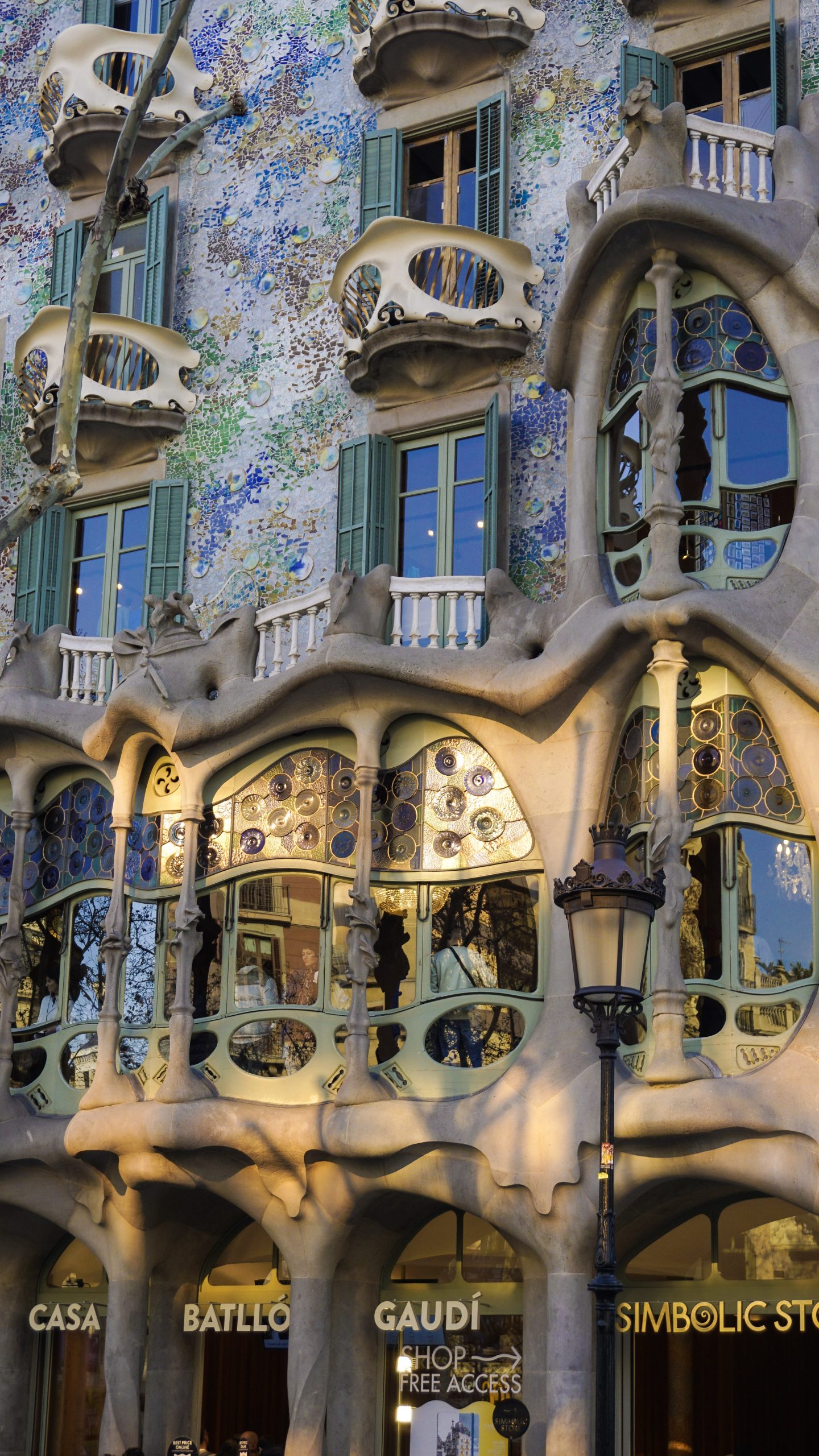 Casa Batllo bone-like balconies and flowing stone facade details.