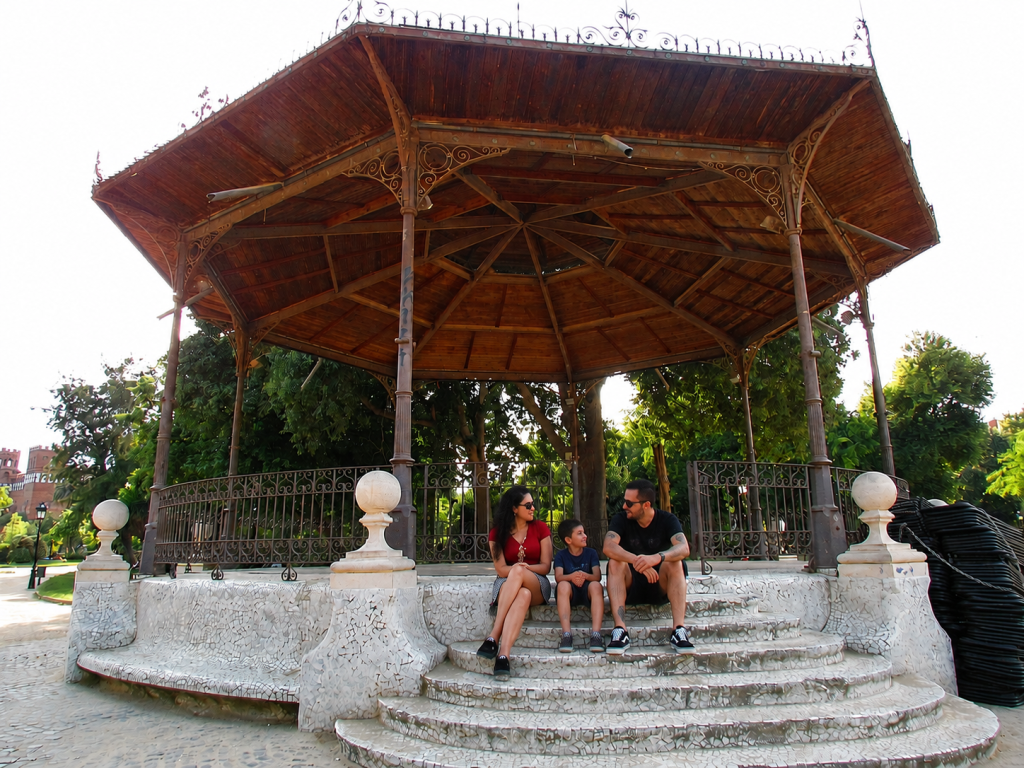 Family sitting at the bandstand in Parc de la Ciutadella in Barcelona.