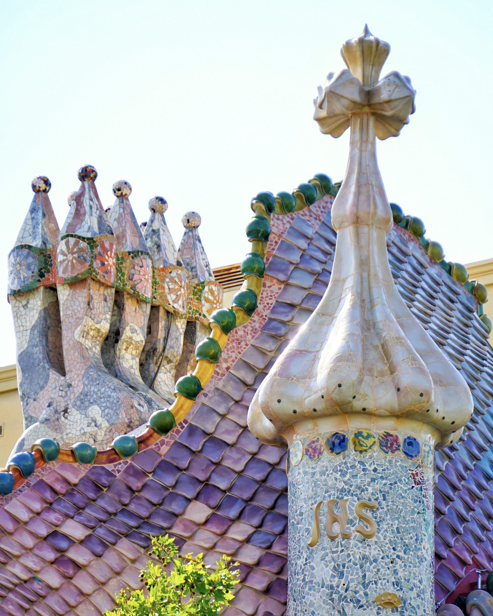 Dragon roof tiles and cross tower detail at Casa Batllo.