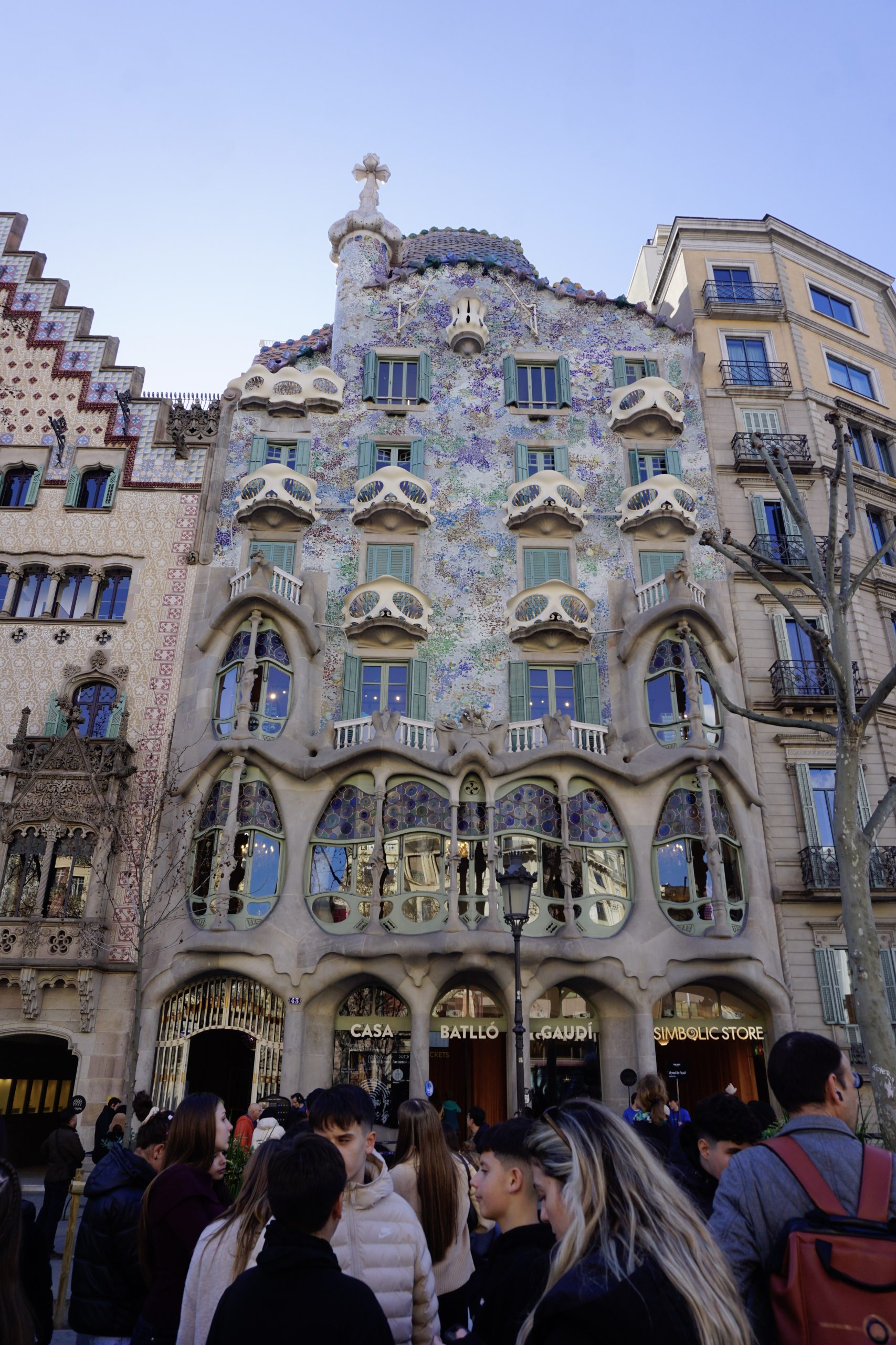 Street view of Casa Batllo and neighboring Modernisme buildings.